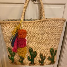 Straw Beach Tote With Sequin Cactus And Multicolor Pompon Tassle Color: Natural Size: Large Never Used Bohemian Straw Bag For Summer Vacation, Casual Straw Bag With Tassels For Vacation, Summer Beach Bag With Tassels For Vacation, Summer Vacation Straw Bag With Tassels, Summer Vacation Tassel Straw Bag, Bohemian Straw Bag With Tassels For Vacation, Green Straw Bag For Vacation, Multicolor Casual Straw Bag For Vacation, Casual Straw Bag With Tassels