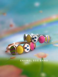 Enamel Easter Egg Ring designed by Love Estella Jewelry. Easter Eggs are not just for hunting, they make adorable jewelry too! Handcrafted with love and attention to detail, this exquisite ring is perfect for those seeking a touch of whimsy and a dash of elegance. Material: Sterling 925 Silver plated 18k Gold. Size: Adjustable Band fits US5-US10 (Fits super comfortably like a fixed ring size). Three hardware available - Rose Gold, Silver & Yellow Gold. Valentine's Day Yellow Gold Enamel Rings, Multi-stone Enamel Ring, Gold Enamel Ring With Multi-stone, Fine Jewelry Multi-stone Enamel Ring, Gold Enamel Multi-stone Ring Fine Jewelry, Egg Ring, Egg Rings, Colorful Ring, Band Fits