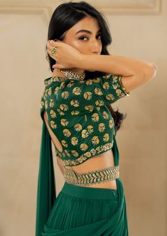 Featuring an emerald green pre-draped sari set paired with raw silk antique motif hand embroidered blouse and our signature belt. Green Anarkali Pre-draped Saree In Raw Silk, Green Pre-draped Saree With Resham Embroidery And Traditional Drape, Green Raw Silk Pre-draped Saree For Reception, Festive Green Raw Silk Pre-draped Saree, Green Embroidered Pre-draped Saree For Reception, Green Designer Choli With Traditional Drape, Green Raw Silk Pre-draped Saree, Designer Green Choli With Traditional Drape, Green Raw Silk Pre-draped Saree In Traditional Drape