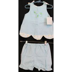 Chez Ami Outfit Baby Blue Plaid 2 Piece Outfit Wide Tank Top With A Kite Embroidery On The Front White Floral Lining And Bows On The Straps Shorts With An Elastic Waist And Ruffles Light Breathable Flannel Fabric New With Tags; Small Brown Spot On The Top Approximate Total Weight: 4 Oz Size 2t Approximate Measurements: Armpit To Pit: 11.75 In (29.5 Cm) Sleeve Length: 1.25 In (3.5 Cm) Shoulder Width: 6.5 In (16.5 Cm) Shirt Length: 13.25 In (34 Cm) Waist: 17 In (43 Cm) Hip: 24 In (61 Cm) Inseam: 2 Cute Sleeveless Blue Sets, Cute Blue Sleeveless Sets, Cute Light Blue Sets For Playwear, Cute Blue Sets For Summer, Cute Blue Summer Bloomers, Casual Blue Bloomers For Spring, Spring Blue Cotton Bloomers, Cute Blue Beachwear Set, Cute Blue Beach Set