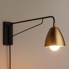 an image of a light that is on the wall with it's arm up