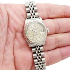 Women's Rolex 26mm DateJust Stainless Steel Watch with Silver Tapestry Dial and Fluted Bezel. Pre-Owned SN# 981**** Brand: Rolex. Gender: Ladies. Model: DateJust. Dial Color: Silver. Condition: Very Good. Model Number: 69174. Crystal: Sapphire Crystal. Case Dimensions: 26mm. Hour Mark: Non-Numeral. Metal Type: Stainless Steel. Bracelet / Strap: Jubilee Stainless Steel. Box / Certification: Rolex Box / Certificate of Authenticity. Warranty: One (1) Year Limited Service Warranty. Formal Jubilee Bracelet Watch Accessory, Silver Formal Watch Bands, Silver Watch Bands For Formal Occasions, Formal Silver Watch Bands, Rolex 26mm, Rolex Women, Steel Watch, Stainless Steel Watch, Steel Bracelet