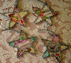 five decorative stars on a lace tablecloth