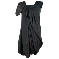 Avant-garde Asymmetrical Hem Evening Dress, Black Asymmetrical Silk Dress, Black Asymmetrical Dress With Pre-draped Neckline, Silk Asymmetrical Evening Dress, Black Silk Mini Dress For Formal Occasions, Black Asymmetrical Neckline Pre-draped Dress, Silk Dress With Asymmetrical Hem For Evening, Modern Knee-length Asymmetrical Dress For Formal Occasions, Sleek Asymmetrical Mini Dress For Evening