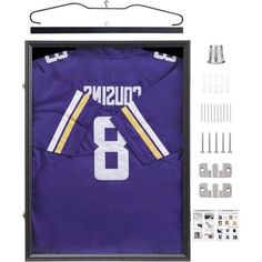 a purple jersey hanging on a hanger next to screws and other items in front of it