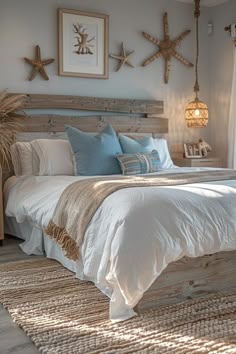 a large bed sitting in a bedroom next to a window with starfish decorations on the wall