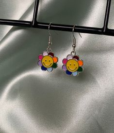 1 pair of silver smiley flower earrings with silicone backs, if you have any questions, please message me!! By JK Crafts Colorful Trendy Earrings With Ear Wire, Trendy Colorful Earrings With Ear Wire, Cute Colorful Earrings As Gift, Cute Colorful Earrings For Gifts, Trendy Multicolor Hypoallergenic Earrings, Cute Colorful Earrings For Gift, Trendy Everyday Flower Drop Earrings, Trendy Single Dangle Flower Earring, Trendy Everyday Flower Earrings