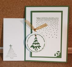 a card with a christmas tree ornament on it