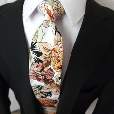 Treat yourself with a new pattern and splash of color to your look with this unique tie. 100% Cotton Handmade Package Includes: Tie Length: 59" Width: 3" Warm iron if needed White Summer Tie, Multicolor Standard Tie For Summer, White Floral Print Ties For Summer, Summer Floral Print White Ties, Summer White Floral Print Ties, Multicolor Summer Ties For Formal Occasions, Multicolor Floral Print Wedding Ties, Multicolor Ties For Black Tie Events In Spring, Multicolor Ties For Spring Black Tie Events