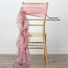 a chair with a pink sash on it