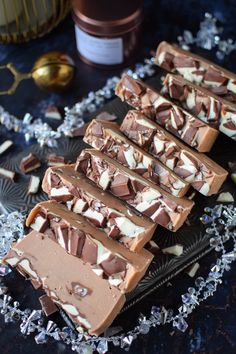 chocolate and marshmallows are arranged on a plate