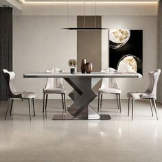 a modern dining room table with white chairs