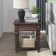 a living room scene with focus on the end table and lamp next to the couch