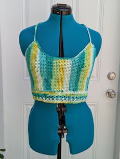 Extra large handmade crochet top with lace-up back in shades of green & yellow. 100% cotton. Sizing (Bust Measurement): XS = 28-30" S = 32-34" M = 36-38" L = 40-42" XL = 44-46" XXL = 48-50" For best care, hand wash or machine wash in delicates bag on a gentle cycle and lay flat to dry. Made from Sneak A Peek pattern (with modifications) by Kelsie at PassioKnit Goods, passioknitgoods.com. Green Sleeveless Summer Crochet Top, Green Sleeveless Crochet Top For Summer, Fitted Green Crochet Sleeveless Top, Green Fitted Sleeveless Crochet Top, Fitted Green Sleeveless Crochet Top, Green Sleeveless Crochet Top With Crochet Trim, Green Crochet Lace Tops For Spring, Green Bohemian Crochet Top For Spring, Fitted Green Crochet Trim Top