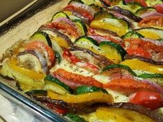 a pan filled with lots of different types of veggies on top of it