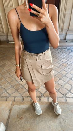 The pockets. The silhouette. The chic waist belt. The Kira Cargo Mini Skirt is too cute for words! Elevate it with a crisp button down, bodysuit, or pretty sweater and youre out the door! Seen styled with our White NikiBikki Bodysuit, Parker Cut Out Slides, and Bella Quilted Purse! 67% Cotton // 33% Nylon Structured fit Belted Front pocket Mini length Summer Cotton Cargo Mini Skirt, Chic Mini Cargo Skirt With Pockets, Fitted Cargo Mini Skirt With Pockets, Beige Mini Cargo Skirt With Pockets, Cotton Cargo Pocket Mini Skirt, Pretty Sweater, Cargo Mini Skirt, Quilted Purse, Pretty Sweaters