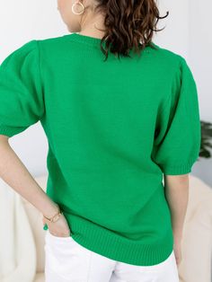 This short sleeve knit sweater features a puff sleeve accent to add a stylish, feminine flair to the look. Sequins make up a script LUCKY and four leaf clover sitting front + center, making this a super cute and fun way to style your St. Patricks Day attire! Sequin accent St. Patricks Day inspired Puff sleeve silhouette Short sleeve sweater silhouette 100% Acrylic Body length measurement: 26" from a S. Bust measurement: 19" from a S. Model is wearing a S. // { const scriptElement = document.querySelector('script[data-lyvecom]'); scriptElement.addEventListener('load', () => { LyveComWidget.mountCarouselComponent({ carouselID: '65d778117957d5853f13e925', parentElement: '.lyvecom_carousel--component', carousel: true, bubbles:true, lng: 'en' }); })})() // ]]> Casual Solid Color Knit Top With Puff Sleeves, Trendy Fall Puff Sleeve Top With Crew Neck, Trendy Puff Sleeve Crew Neck Top For Fall, Trendy Puff Sleeve Top With Crew Neck For Fall, Trendy Green Cotton Puff Sleeve Top, Trendy Knit Top With Puff Sleeves, Fall Cotton Puff Sleeve Top With Short Sleeves, Cotton Puff Sleeve Top For Fall, Trendy Short Sleeve Puff Sleeve Top For Fall