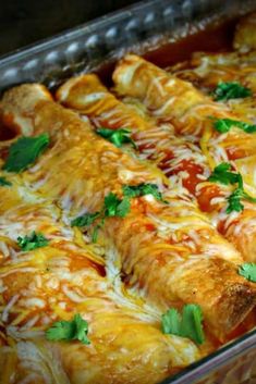 a casserole dish filled with meat, cheese and sauce covered in parsley