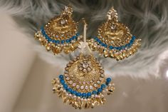 Handcrafted with love to give a real traditional look for this set beautifully studded with stones gives a royal look. Includes: Earrings and Tikka Traditional Festival Earrings With Stones, Kundan Earrings With Stones For Wedding, Kundan Earrings With Stones For Celebration, Festive Traditional Earrings With Stones, Festive Stone Earrings, Gold Earrings With Stones For Festive Occasions, Traditional Look, Royal Look, Jewellery Sets