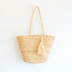 IN STOCK NOW SHIPPING FROM LOS ANGELES Take on any adventure with our handmade raffia straw bag! Its natural color and durability make it perfect for everyday use and the beach. With a strong shoulder strap, you can confidently carry all your essentials with ease. Upgrade your summer style with this bold and sturdy bag!Natural Soft Raffia StrawUnlinedHandmadeSize: 9"H x 13"W x 5.5''DStrap drop length: 10" Designer Style ID: 8668 Natural Fiber Shoulder Bag For Vacation, Natural Summer Shoulder Bag In Natural Fiber, Natural Straw Travel Bag, Natural Fiber Summer Shoulder Bag, Natural Palm Leaf Beach Bag For Travel, Beachy Straw Bag With Adjustable Strap, Natural Woven Shoulder Bag For Beach, Beachy Natural Woven Shoulder Bag, Natural Palm Leaf Crochet Bag For Vacation