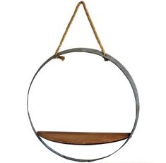 a metal and wood circular hanging shelf with rope