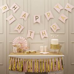 a birthday party with pink and gold decorations