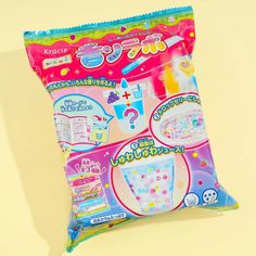 a bag of candy on a yellow background