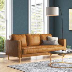 a living room scene with focus on the couch and coffee table in the foreground