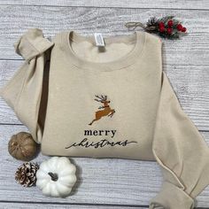 Embroidered Sweatshirts, Merry Christmas Embroidered Sweatshirt Christmas Deer Sweatshirt Crewneck, Women’s Embroidered Sweatshirts – Excoolent Embroidered Sweatshirts redefine casual comfort with a touch of artistic flair. Each sweatshirt is meticulously crafted, featuring intricate embroidery that adds a unique, handcrafted touch. Made from high-quality, cozy fabric, they offer warmth and style in one. The embroidery not... Deer Sweatshirt, Christmas Crewneck, Trendy Street Style, Embroidered Crewneck, Reindeer Christmas, Sweatshirt Crewneck, Embroidered Sweatshirt, Christmas Deer, Embroidered Sweatshirts