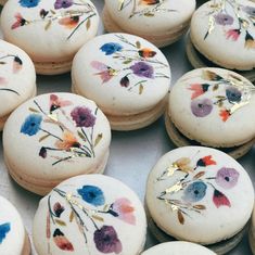 many decorated cookies with flowers on them