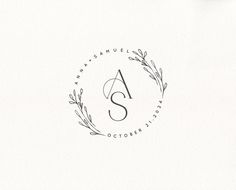 the letter s is inscribed in a circle with leaves