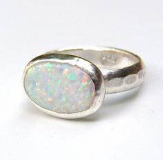 OPAL RING You are looking at a beautiful HAND MADE silver with opal stone. The stone are setting in 925 sterling silver bazel It is impressive, powerful and very beautiful ring. Made to order any size.. This ring can be made to order in any size. Please note your desired size in the message to seller area at checkout. size stone is 10mmX14mm width ring: 3mm Come in a gift box. Fallow me on facebook for newest updates. http://www.facebook.com/pages/Orit-Naar-jewelry/174677569247132?sk=wall Opal Stone Ring, Handmade Engagement Ring, White Opal Ring, Silver Opal Ring, Mom Ring, Dainty Gold Rings, Handmade Engagement Rings, Ring Oval, Oval Stone