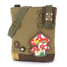 MUSHROOM Patch Crossbody Bag in Dark Olive by Chala Brand new with tag. Size 10w in x 4d in x 10.5H inches Strap adjustable: 13-26 inches  Super cute & casual this  purse includes the MUSHROOM coin purse/Key charm! The Crossbody style is so practical too. Accented with fabricated flower & fun wood buttons. The Top Zip closure makes it easy to get into. Love  the antique brass toned hardware and fully lined interior. One interior zippered pocket Two interior slide pockets Detachable MUSHROOM bag charm/coin purse Material: Washed canvas cotton, leather, & textured faux leather International buyers:  Shipping and handling do not cover taxes and fees due your country destination.   We make sure that we ship the next business day of cleared payment.  Please email us for questions.  Thank you fo Mushroom Coin Purse, Mushroom Purse, Mushroom Patch, Green Gift, Mauve Purple, Wood Buttons, Canvas Messenger Bag, The Mushroom, Green Gifts