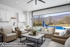 a living room filled with furniture next to a swimming pool