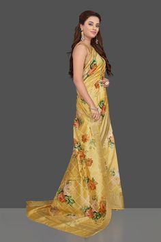 Wear this stunning yellow floral print muga silk saree for a unique ethnic look on festive occasions! The saree is enhanced with bright floral print and zari border. The saree can be worn on any special occasion, just elevate with ethnic earrings! It comes with a matching blouse piece. Shop designer sarees in USA from Pure Elegance. Shop stunning mustard Lucknowi work georgette saree online in USA. Make you presence felt with your Indian style on special occasions in beautiful designer sarees, e Muga Silk Saree, Muga Silk, Tussar Silk Sarees, Fashion Journals, Ethnic Looks, Tussar Silk Saree, Silk Sari, Saree Online, Silk Sarees Online