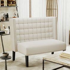 a living room with a white couch and coffee table