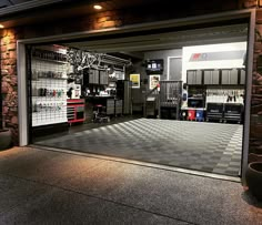 an open garage door with various tools on display in the center and checkered tile flooring