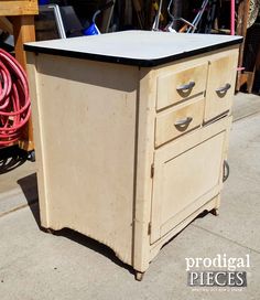 an old wooden cabinet sitting on top of a sidewalk