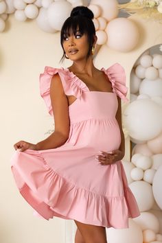 We just love this dreamy, ultra-feminine babydoll style maternity mini, babe. Expertly crafted in a delicate luxe woven fabric, our "Dolly Daze" mini dress is the epitome of girl-next-door chic. Super girly with a vintage feel, this style will make you well ahead of the fashion pack with its statement ruffle sleeves, bust-flattering neckline and thigh-skimming hem. Where to WearPerfect for your baby shower, weddings, date nights, and relaxing picnics with bae. We also love this dress for festivals. Style WithRock the festival look by teaming this dress with a floppy hat and oversized sunnies. Also looks gorge with strappy heels or flat sandals. Up the glam factor by adding delicate jewellery and a sparkly clutch. Underwear SolutionsLace Be Honest nipple coversProduct DetailsModel is 5’9 an Girly Maternity Outfits, Vestidos Para Baby Shower, Babydoll Mini Dress, Picnic Dress, Ultra Feminine, Baby Shower Dresses, Babydoll Style, Stylish Maternity, Shower Dresses