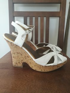 These are such lovely Chinese Laundry wedge sandals ! Made of real leather and cork. Pre-owned, used few times.  Great find for summer! Insole length:approx. 27 cm Heel height: 13 cm Platform: 3 cm I expect payment to be done within 48h. I will ship immediately after payment cleared. Buyer is responsible for possible governmental fees in his/her country. All sales are final. Thank you for shopping with me:) White Wedge Sandals With Cork-bed Midsoles, Cork Heels With Wooden Heel And Round Toe, White Cork Sandals For Summer, White Cork Open Toe Sandals, White High Heel Wedge Sandals With Wooden Heel, White Open Toe Wedge Sandals With Wooden Heel, White Wedge Sandals With Wooden Heel, White Leather Wedge Sandals With Wooden Heel, White Cork Sandals For Spring