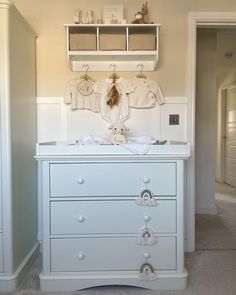 a baby's crib in the corner of a room next to a closet