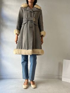 - Vintage gray knit winter coat - Feels like a wool shell  - Quilted lining - Faux fur trim - No size or fabric content tags - Small Chest: 17.5" Waist: 16" Length: 36" We are not responsible for lost, stolen, or damaged packages once they have been shipped. Any additional customs duties or taxes incurred on international orders are the responsibility of the buyer. Please note that our items are vintage and may have minor flaws or imperfections due to their age, which adds to their unique charac Wool Fur Coat With Faux Fur Trim For Winter, Winter Wool Fur Coat In Beige, Beige Wool Fur Coat For Winter, Winter Beige Wool Fur Coat, Beige Winter Fur Coat, Wool Coat With Faux Fur Trim For Winter, Winter Wool Coat With Faux Fur Trim, Fitted Wool Fur Coat For Winter, Wool Outerwear With Faux Fur Trim For Cold Weather