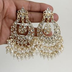 White gold Pearl Kundan chandbali Earrings, White chandbali earrings, Indian pakistani wedding jewelry, bridesmaid gift Indo Western Chand Earring With Gold Plating Product Weight = 25 grams each earring Height = 95 mm || Width = 60 mm Trendy Design Indo Western Earring Arrives in a gift box Color, shades, texture displayed may slightly vary from the actual product due to digital image limitations. We request you to consider these minor variations. Please expect the possibility of some slight imperfections when buying handmade jewelry. If you have any questions, please contact us. Luxury Cutdana Chandbali Pearl Necklace, Luxury Fusion Style Chandbalis For Wedding, Luxury Wedding Chandbali Pearl Earrings, Luxury Chandbali Danglers For Anniversary, Luxury Chandbali Earrings For Eid, Luxury White Meenakari Bridal Earrings, Luxury Chinon Palazzo Set Chandbali Style, Luxury Pearl Drop Chandbalis For Celebration, Luxury Chandbali Jewelry For Celebration