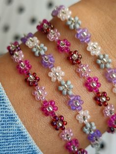 Multicolor Flower Friendship Bracelets, Trendy Multicolor Flower Beaded Bracelets, Trendy Multicolor Bracelets With Flower Charm, Pink Flower Friendship Bracelets With Tiny Beads, Trendy Multicolor Bracelet With Flower Charm, Multicolor Trendy Bracelet With Flower Charm, Trendy Flower-shaped Bracelets With Colorful Beads, Trendy Flower Bracelet With Colorful Beads, Pink Flower-shaped Friendship Bracelets With Tiny Beads