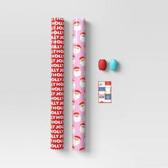 a roll of wrapping paper next to some candy and candies on a white surface