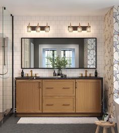 a bathroom with two sinks, mirrors and a bathtub next to a walk in shower