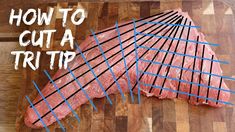 how to cut a strip of meat on a cutting board with blue lines in the middle