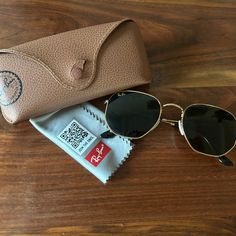 Ray-Ban Hexagonal Flat Lenses Sunglasses. Model Code Rb3548n 001 54-21, Lens Width: 54, Bridge Width: 21, Green Classic Lenses G-15. I Purchased These In 2022 But, I Buy A Lot Of Sunglasses And Don’t Need These Anymore. Still In Great Condition. Comes With Case (Although Snap Is Broken) And Cleaning Cloth. In Addition To The Pictures I’ve Taken, I’ve Also Provided Some Pictures From Ray-Ban’s Website For Added Perspective. The Following Description Was Taken From Ray-Ban: Ray-Ban Hexagonal Flat Lenses Are A New Take On The Iconic Metal Hexagon Shape, Featuring An Irregular Frame Design. With Its Classic G-15 Green Lenses And Gold Metal Frame, These Sunglasses Are Perfect For Those Nose Shapes, Sunglasses Model, Green Lenses, Color Lenses, Classic Gold, Hexagon Shape, Colored Sunglasses, Some Pictures, Cleaning Cloth