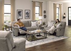 a man and woman sitting on couches in a living room