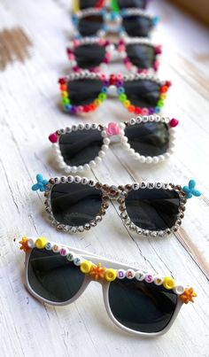 several pairs of sunglasses with beads on them